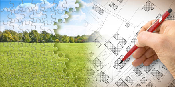 Planning a new city - concept with professional planning an imaginary cadastral map of territory with buildings and roads against a green area